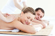 Affectionate couple having a back massage with closed eyes Affectionate couple having a back massage with closed eyes