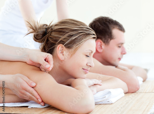 Photo: Loving couple having an acupunctre therapy Loving couple having an acupunctre therapy