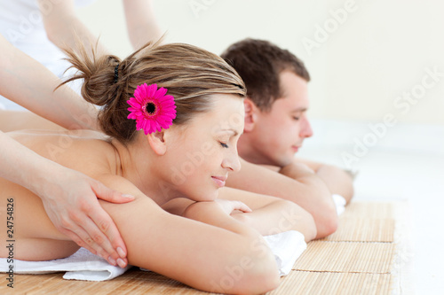 Photo: Relaxed couple having a back massage Relaxed couple having a back massage