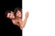A cute couple behind a white wall