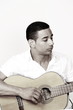 Guy with guitar, black and white