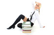 tired schoolgirl sitting with books