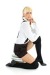 schoolgirl sitting on stacked books