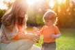 Happy mother and her little son outdoors session