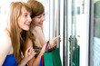 Women looking in shop window