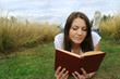 Woman reading book outdoor