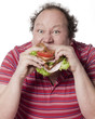 homme obèse mangeant un sandwich