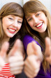 Girls with thumbs up