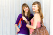 Young women carrying books