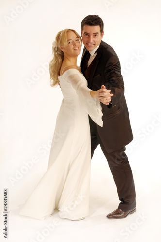 Photo: Portrait of the young happy newlyweds on white background Portrait of the young happy newlyweds on white background