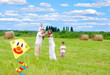 Happy family with pregnant wife fly a kite together in summer