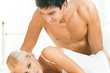 Young attractive happy amorous couple at bedroom