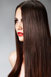 Fashion model with straight long hair and red lips