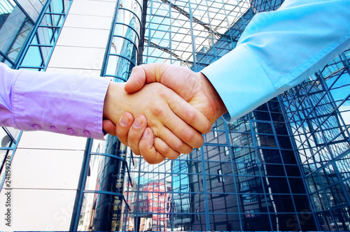 Photo: Shaking hands of two business people Shaking hands of two business people