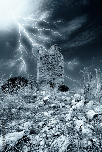 Photo: old tower under the storm old tower under the storm