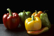 Photo: Bell and Chili peppers against black Bell and Chili peppers against black