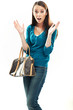 Beautiful shocked brunette shopping