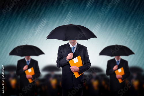 Photo: Businessmen in rain Businessmen in rain