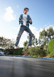 Photo: Young Man Jumping On Trampoline Caught In Mid Air Young Man Jumping On Trampoline Caught In Mid Air