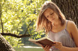 Beautiful girl reads book