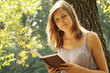 Beautiful girl reads book