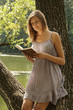 Beautiful girl reads book