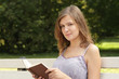 Beautiful girl reads book
