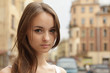 Closeup portrait girl posing on urban background.