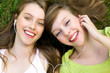 Two teenage girls listening to MP3 player