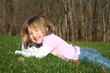 Smiling Girl Lying in Grass Smiling Girl Lying in Grass