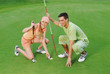 The young loving pair on the golf