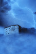 spectral castle shrouded by clouds fog and lightning