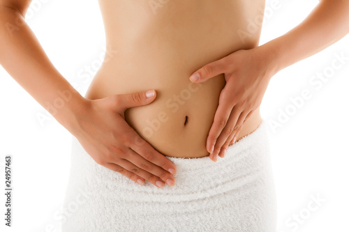 Photo: Woman massaging pain stomach isolated on white Woman massaging pain stomach isolated on white