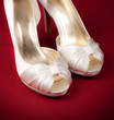 Two wedding rings and bride's shoes Two wedding rings and bride's shoes