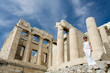 Woman near Propylaea Columns Acropolis Athens Greece on sky back