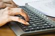 closeup view of female fingers typing on the keyboard closeup view of female fingers typing on the keyboard