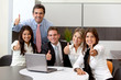 Business team with thumbs up