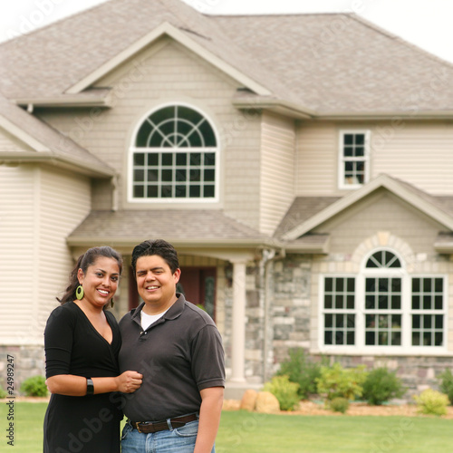 Photo: Happy couple in front of a house portrait Happy couple in front of a house portrait