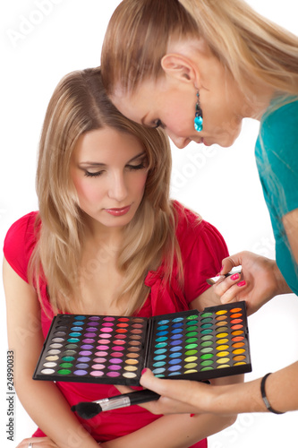 Photo: Make-up girl showing range of collors Make-up girl showing range of collors