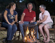 Family at campfire in the garden