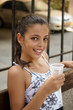 Girl drinks water .