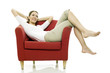 Photo: Young woman sitting on a chair on white background studio Young woman sitting on a chair on white background studio