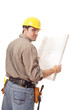 Back view of worker with blueprints