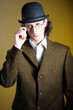 Photo: Close up portrait of young english gentleman in bowler hat and r Close up portrait of young english gentleman in bowler hat and r