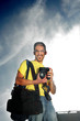Happy professional photographer with camera outdoors