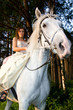 Horse riding wedding woman at sunset