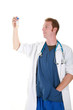 A scientist holds a test tube in gloved hands.