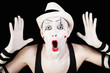 mime in striped gloves and white hat