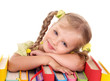 Child holding pile of books.