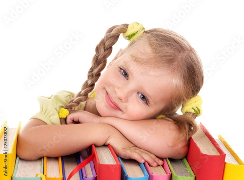 Photo: Child holding pile of books. Child holding pile of books.